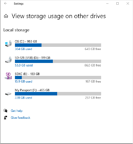 This screenshot shows the View Storage Usage On Other Drives page, with graphical depictions of four storage devices, three removable drives and a nonremovable system drive.