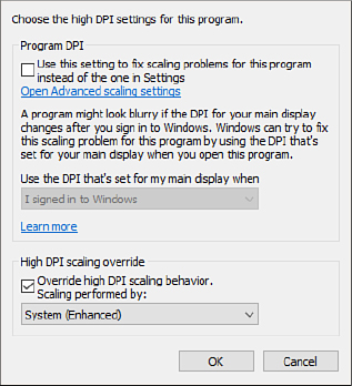 This partial screenshot shows the High DPI Settings section from the Compatibility tab of an executable file. The Override High DPI Scaling Behavior setting is selected, and System (Enhanced) is visible in the list below that setting.