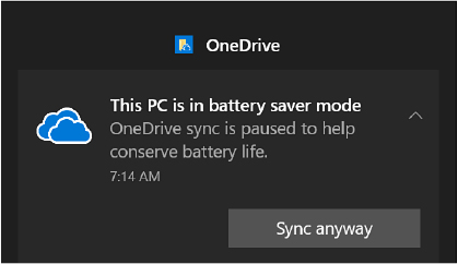 A screenshot shows the notification from OneDrive. The message “This PC is in battery saver mode, OneDrive sync is paused to help conserve battery life” is displayed here. Sync anyway button is provided below this message.