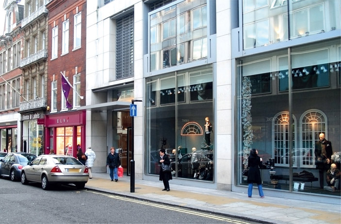 Figure 3.5 The scale of the parts of a building, such as shop windows, can be as important as its overall height. Here the shop windows are excessively tall in relation to people and the proportions of the street, the pavement and other elements of the buildings.