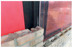 Figure 5.19 EPDM seal adhered to red breather membrane (top right).