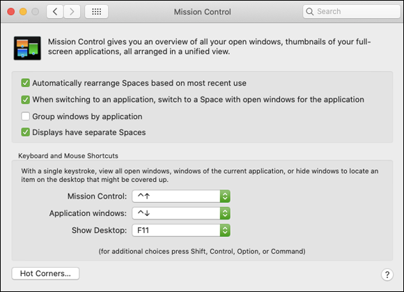 Screenshot of Mission Control pane displaying options including keyboard and mouse shortcuts. A Hot Corners button is located at the bottom left.