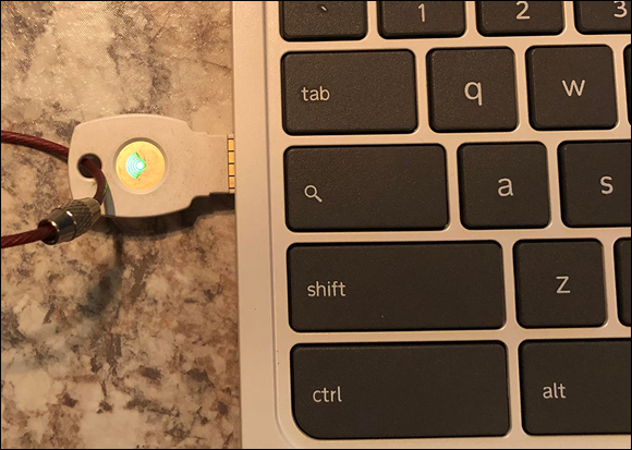Photo depicts a Google Titan USB key to complete logging on to a Chromebook with Google Advanced Protection.