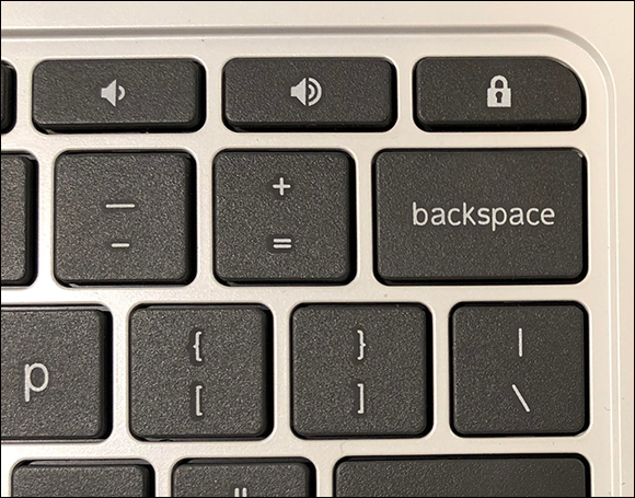 Photo depicts locking the Chromebook with the Lock key on the keyboard.