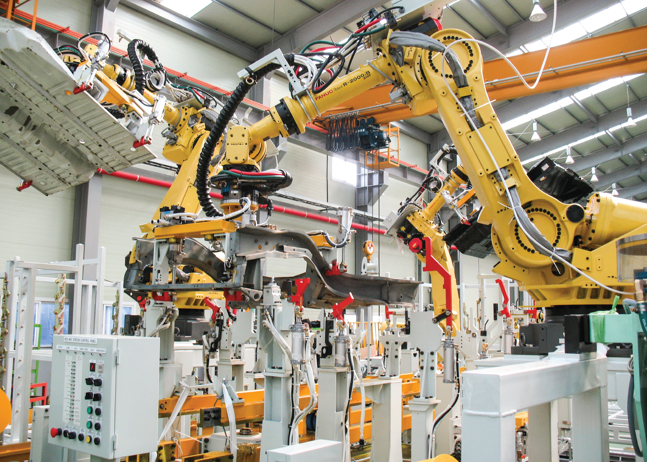 Photograph of a FANUC Robot model that will make Apple iPhone cases in the near future.