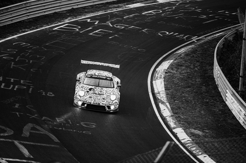 Image of a racing car moving on the racing track.