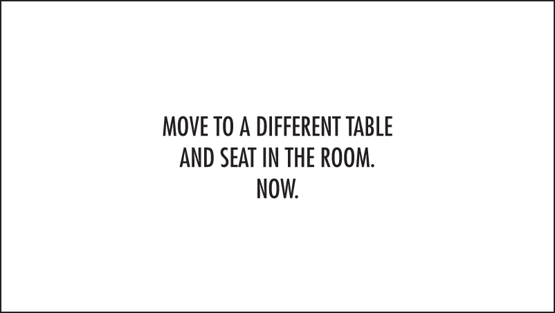 Image of a slide displaying the instruction to “Move to a different table and seat in the room. Now”, an example of an icebreaker.
