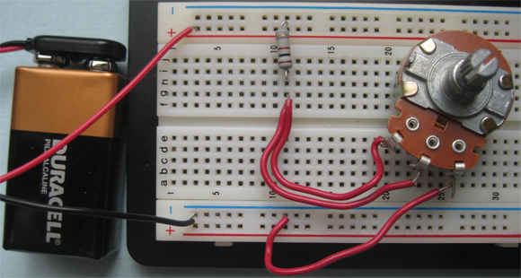 Your solderless breadboard makes the connections between components in this simple series circuit.