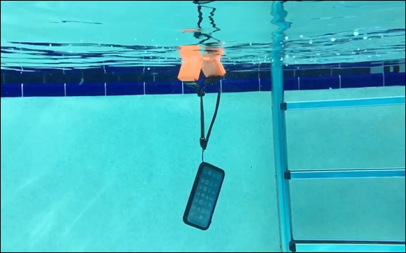 Photo depicts a catalyst brand floating lanyard and waterproof case protecting an iPhone from loss and water damage.