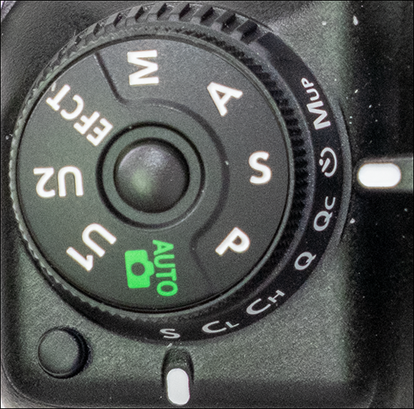 Image of the mode dial lock release for rotating the mode dial to shoot in shutter-priority auto (S) mode.