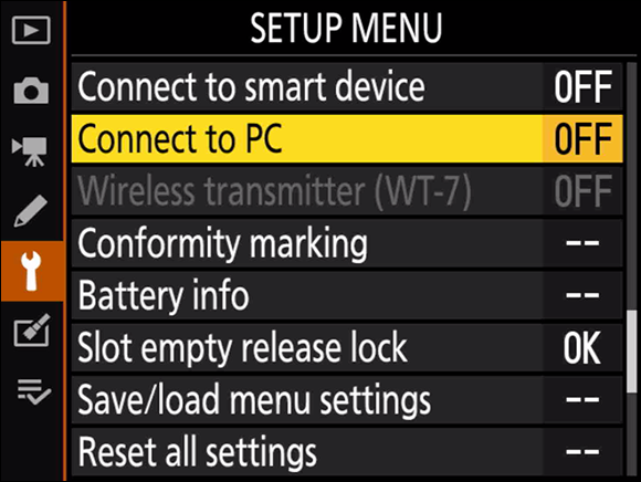 Illustration of the Setup Menu on the multi selector to scroll to the Connect to PC option as the first step to connect to your local network.