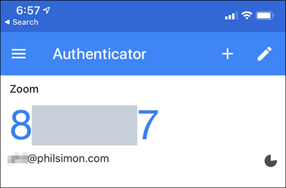 Illustration of a partially redacted Zoom six-digit verification code displayed in a Smartphone's Google Authenticator app.