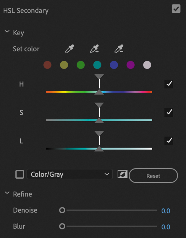 A screenshot of the HSL secondary section under Lumetri color panel used to set color to specific sections of the image by adjusting Hue, Saturation, and Luminance ranges. The refine feature helps to set the Denoise and Blur levels.