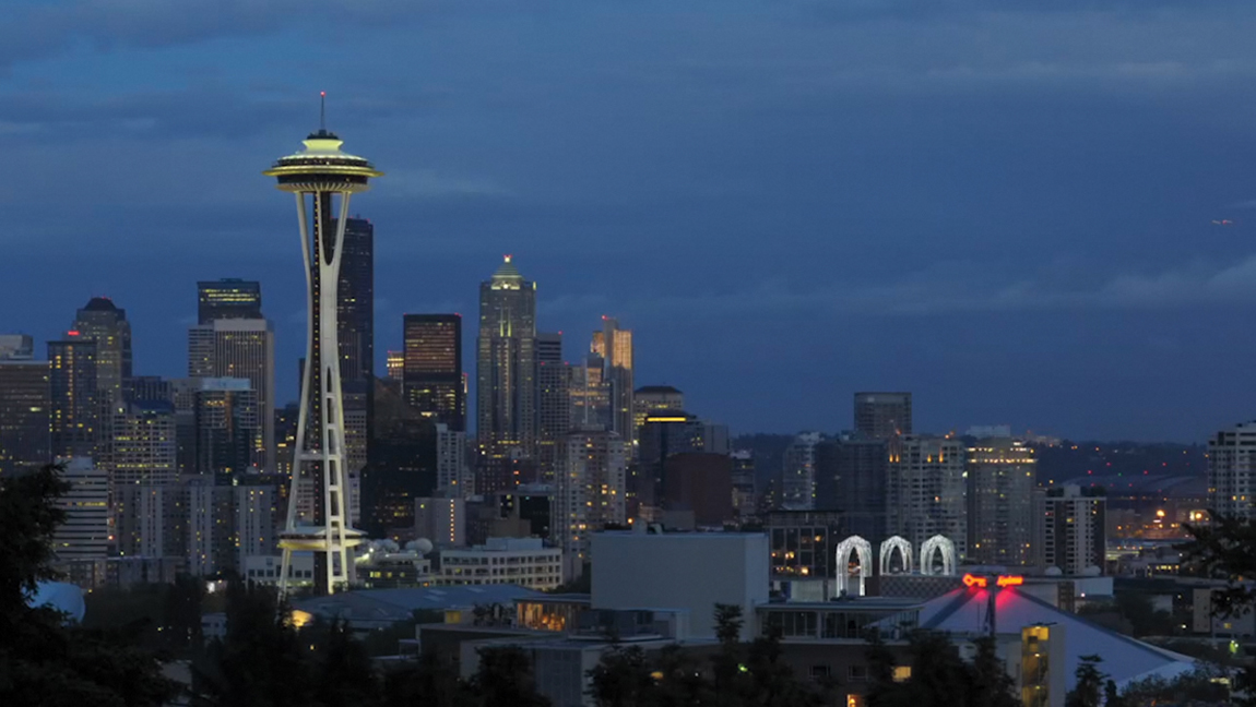 A screenshot of the clip in the sequence skyline. skyline in Seattle region with elevated constructions is shown.