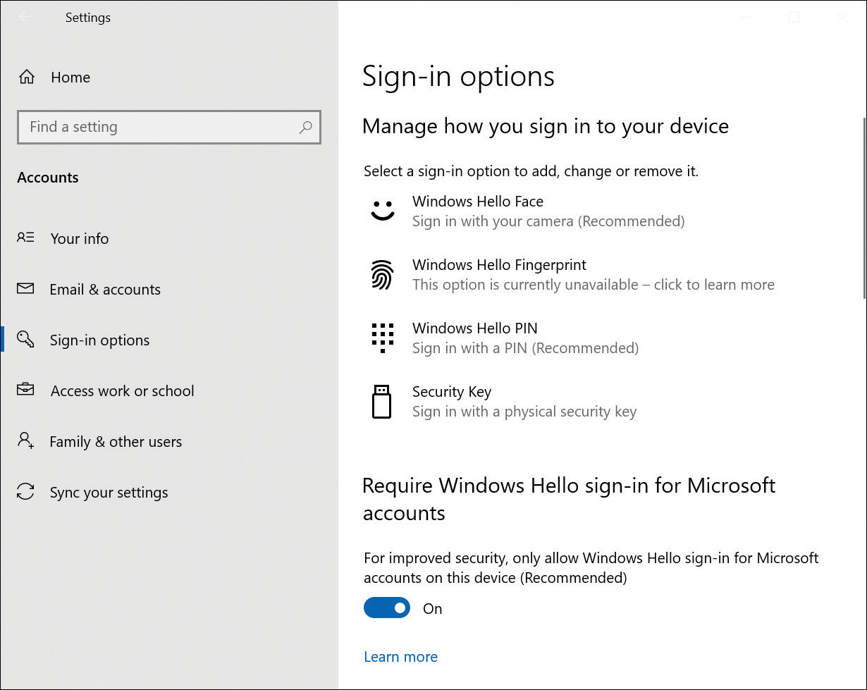 This screenshot shows the Setting App with the Sign-In Options tab displayed, which includes several sections: Windows Hello Face, Windows Hello Fingerprint, Windows Hello PIN and Security Key. Underneath this is text that says Require Windows Hello Sign-in For Microsoft Accounts on This Device (Recommended) and a toggle slider to switch on, or off the option to only allow Windows Hello sign-in for Microsoft accounts on this device. This slider is set to On.