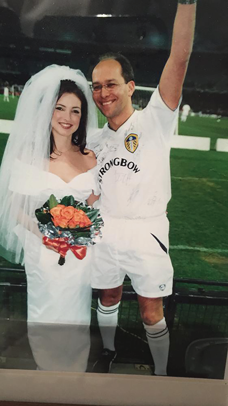 Photo depicts Gabby and his wife wearing her wedding gown.