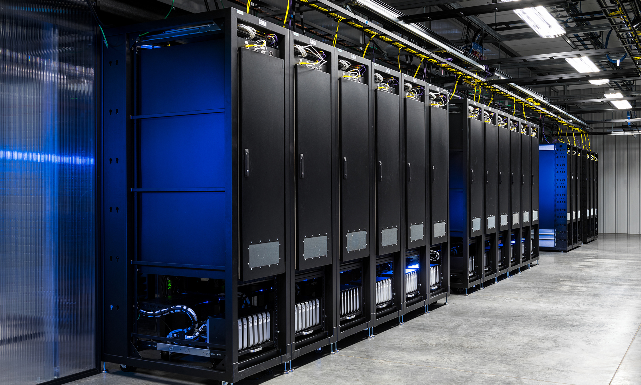 Photo of a data center holding mobile devices in rack enclosures.