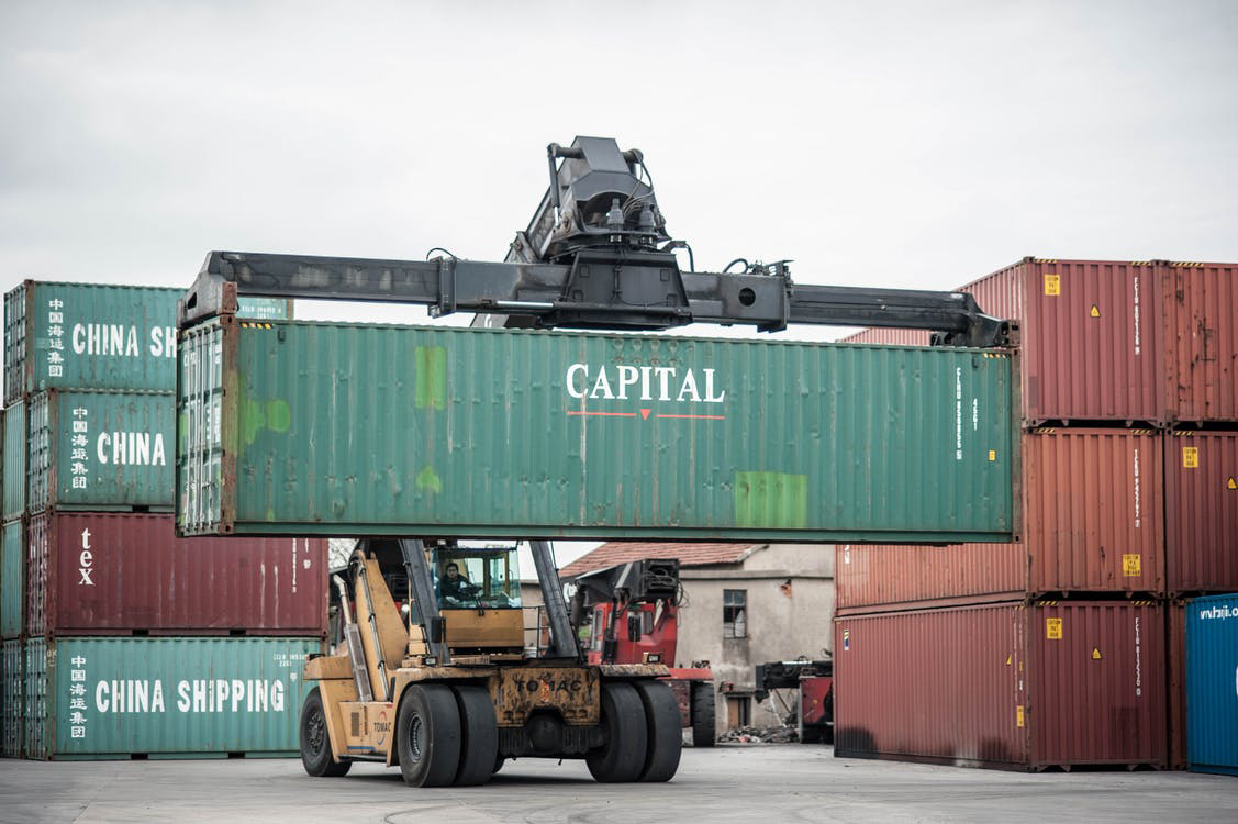 A crane lifting a shipping container