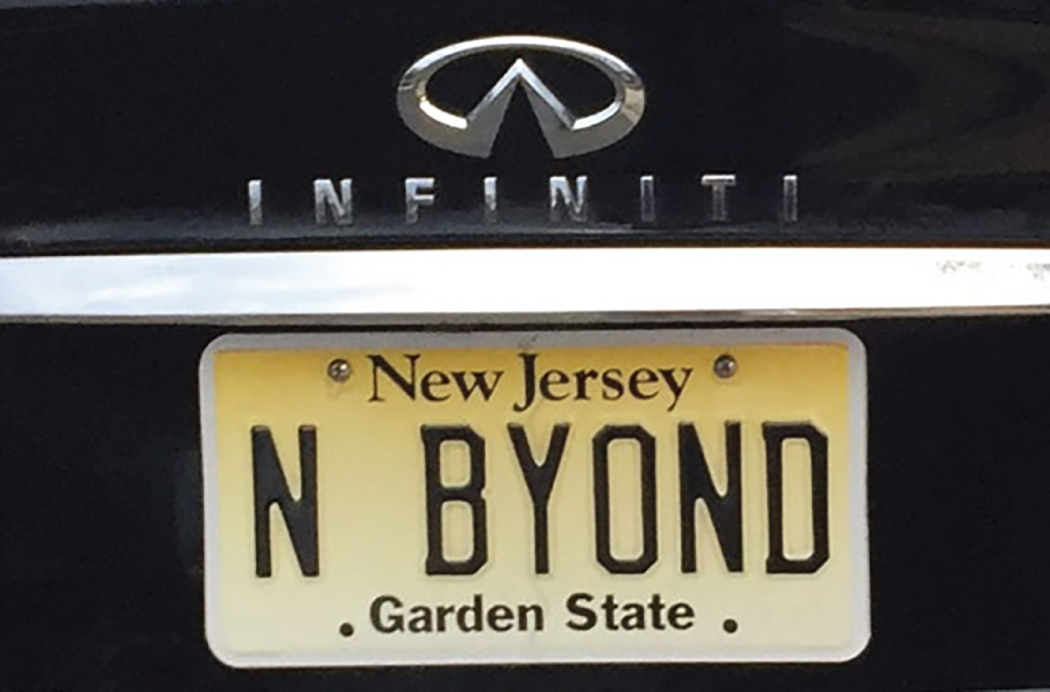 Photo depicts a license plate that reads, N BYOND Garden State.