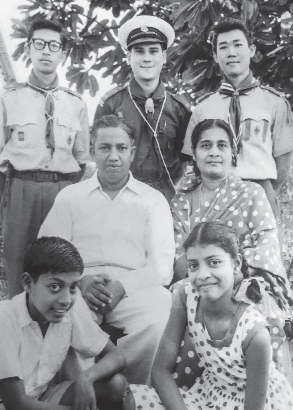 Photograph of the author with his parents and two of his scout friends, and two children - a boy and a girl - seated in front of his parents.