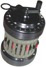 Photo depicts the Curta mechanical calculator.