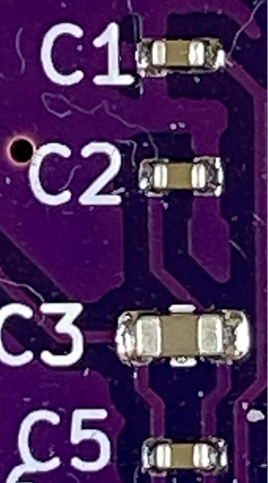 Figure 7.9 – Reflow soldered 0402 package capacitors
