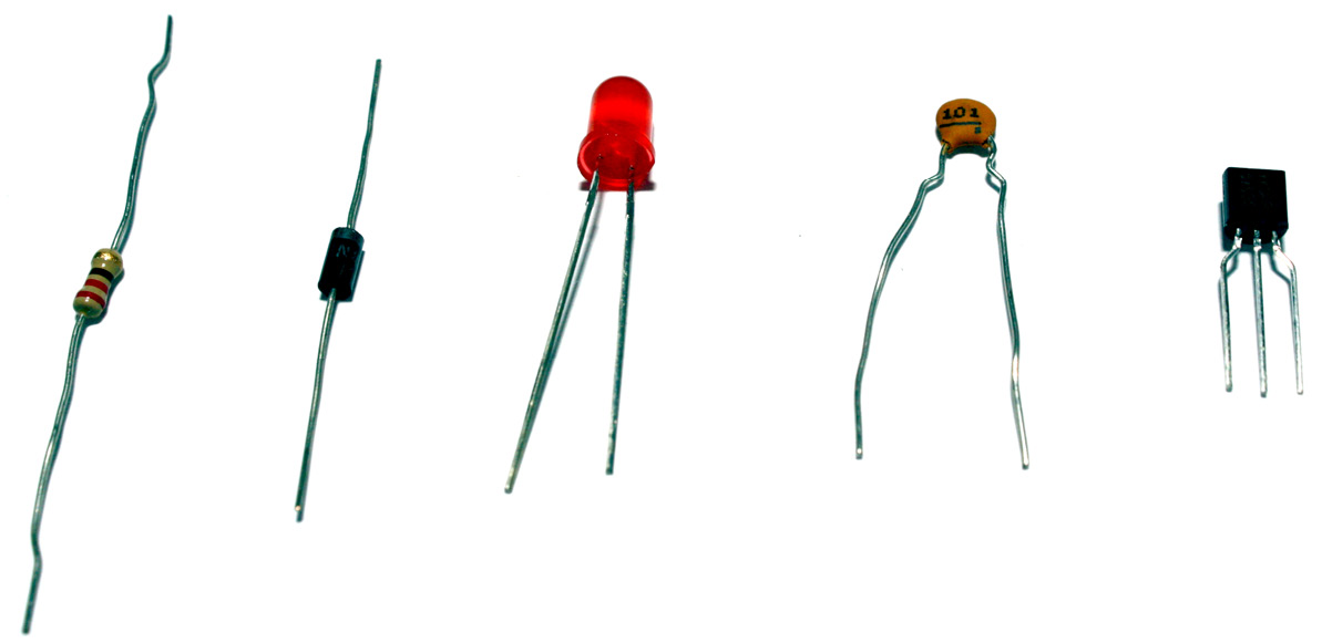 Figure 1.3 – Electronic components (shown from left to right): a resistor, a diode, an LED, a monolithic capacitor, and a transistor