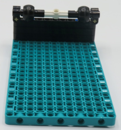 Figure 5.9 – Back wheels added to teal plate
