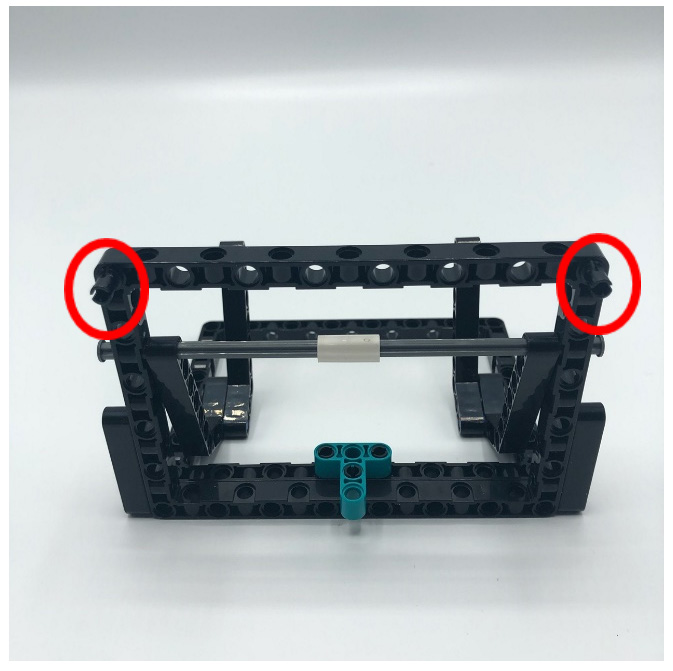 Figure 4.9 – Black connector pins in top corners of open frame
