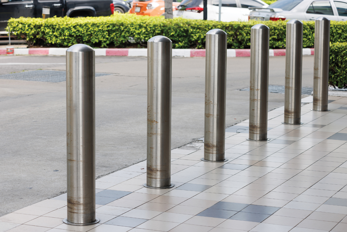 A stainless Steel bollard is placed on the road or building for fencing.