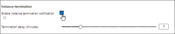 A screenshot of the Instance Termination section in the Management tab of the VM Scale Set Creation wizard. The Enable Instance Termination Notification check box is selected, and the Termination Delay (Minutes) slider is set to 7.