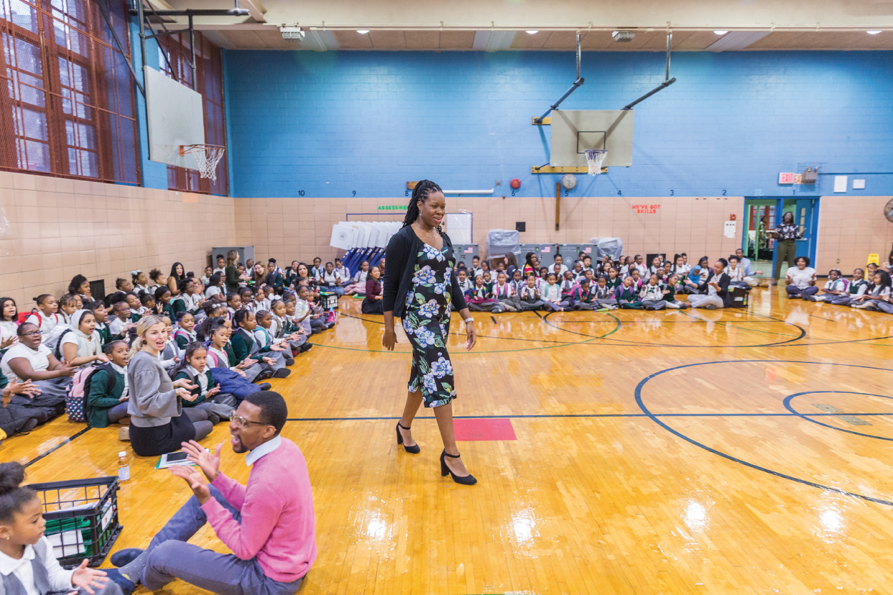 Photograph of Nikki Bowen with her students at Excellence Girls Charter School in Brooklyn.