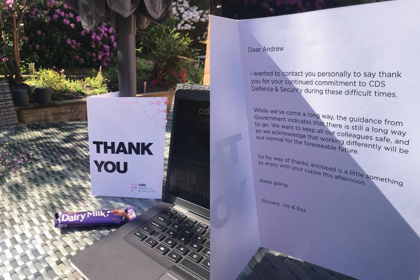 Photo depicts a chocolate , laptop and a letter place on a table.