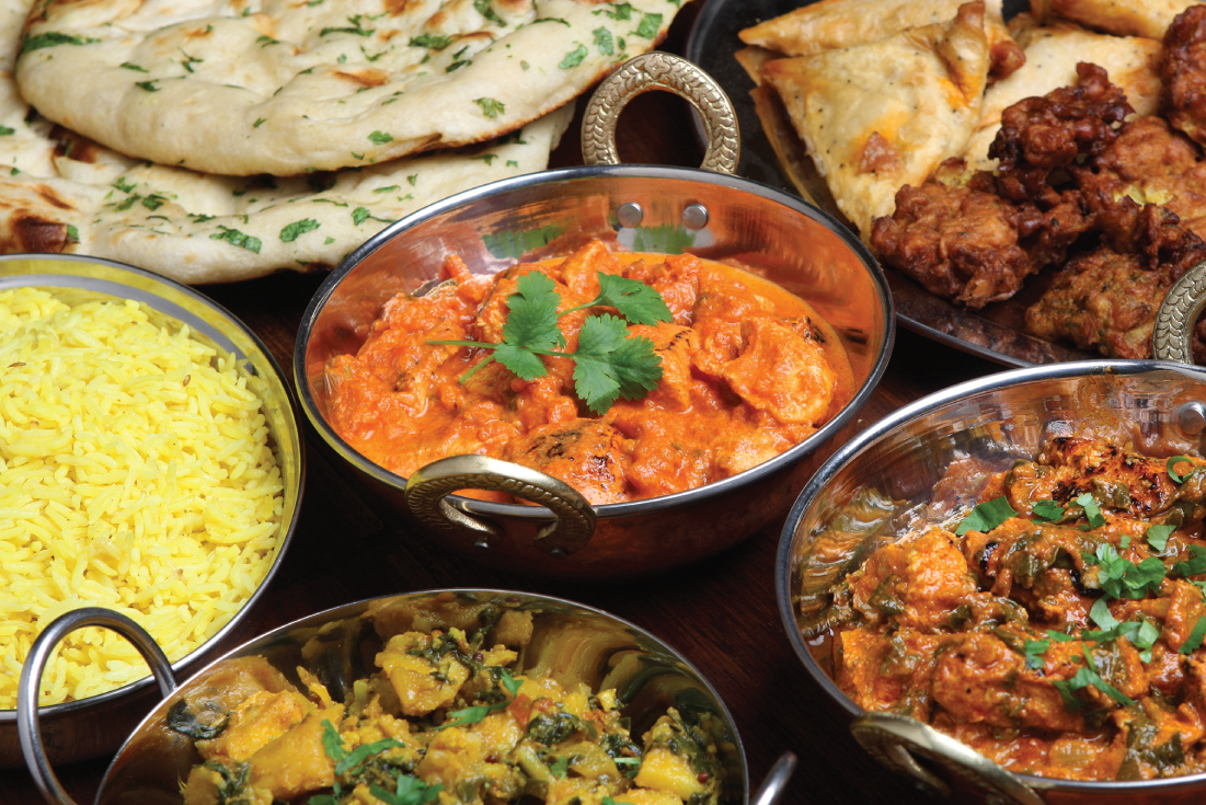 Photo depicts an Indian thali of dishes that can be both “spicy hot” and “temperature hot”