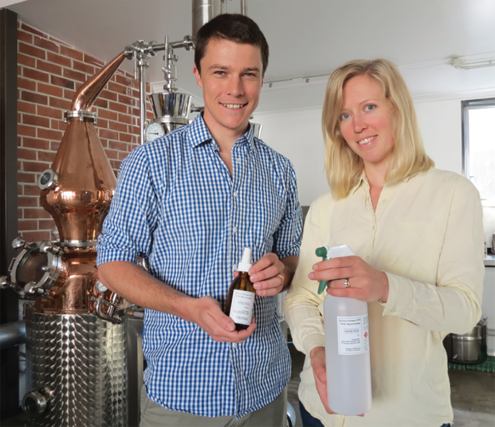 Photograph of Saskia and Andrew Lewis from Fonterra’s Clandeboye site, put their boutique gin distillery to good use and produced hand sanitiser.