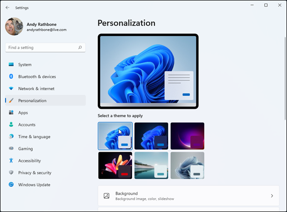 Snapshot of choosing a preconfigured theme to change how Windows looks and sounds.