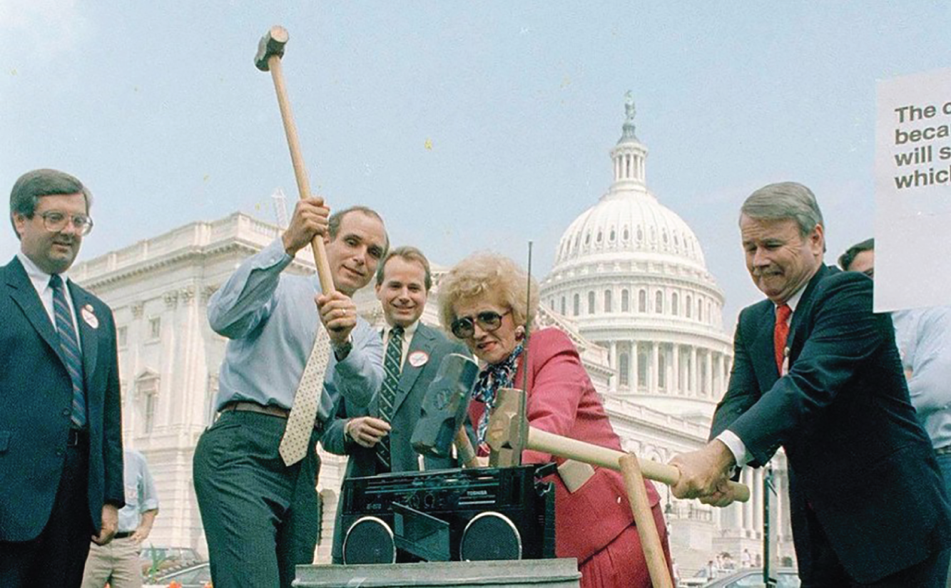 Photograph of smashing a Chinese cell phone on the stairs of Capitol Hill, America.