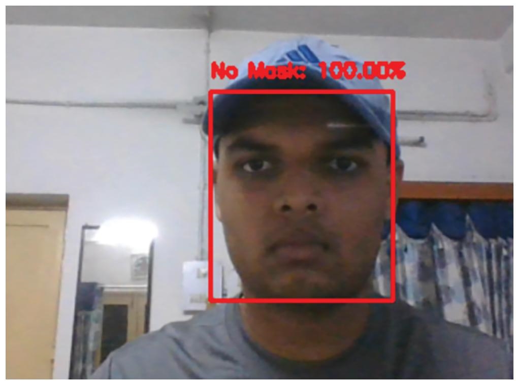 Photograph of in real time with cap, face detected without a mask with 100 percentage accuracy.