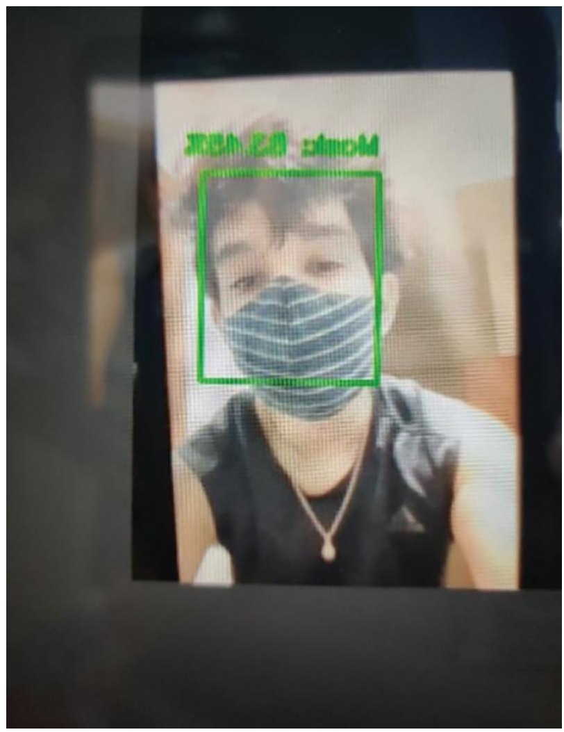 Photograph of in real time ,the persons face in the image is detected with the mask with 92 percentage accuracy.