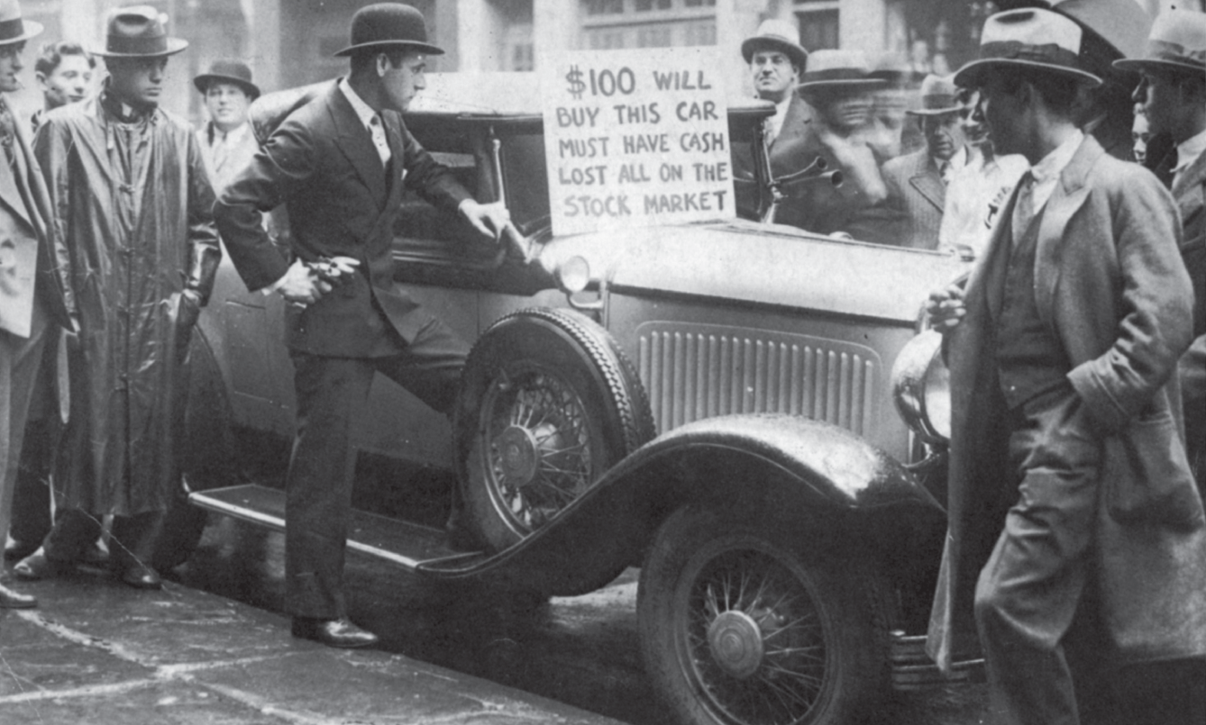 Photograph of a small crowd of men in slacks, blazers and brimmed hats.