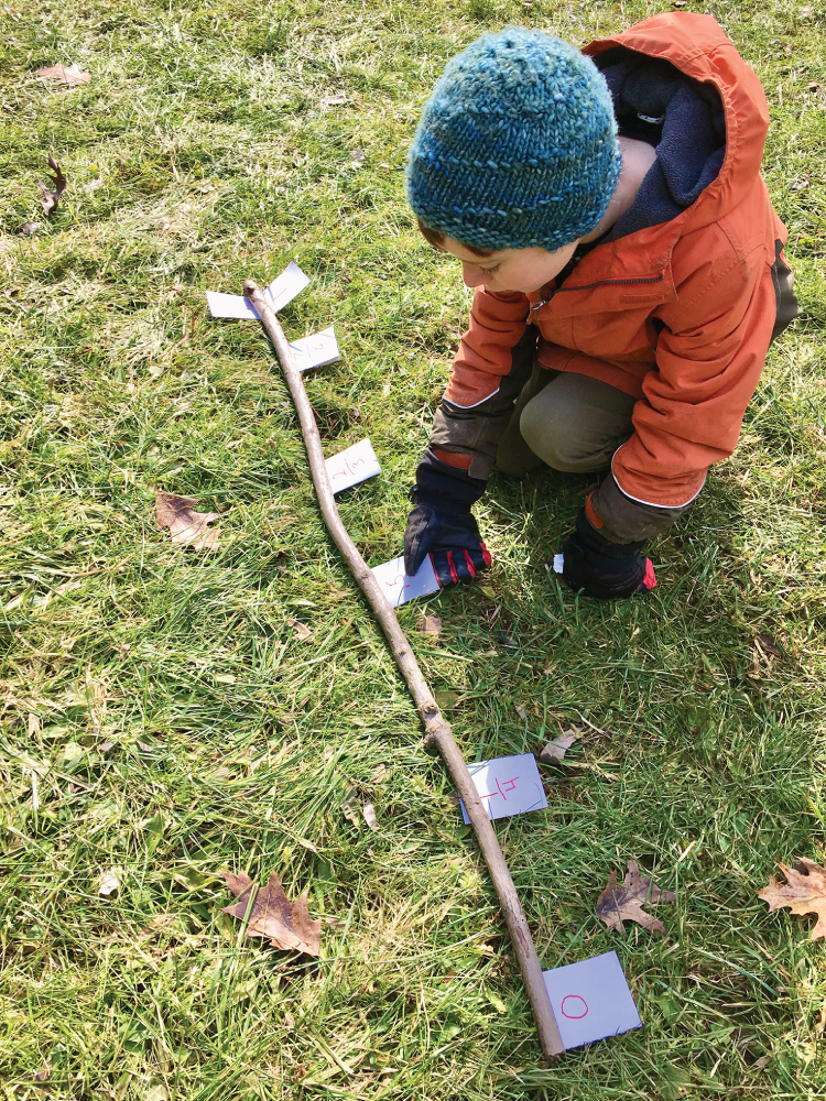 Photo depicts using a stick for a number line.