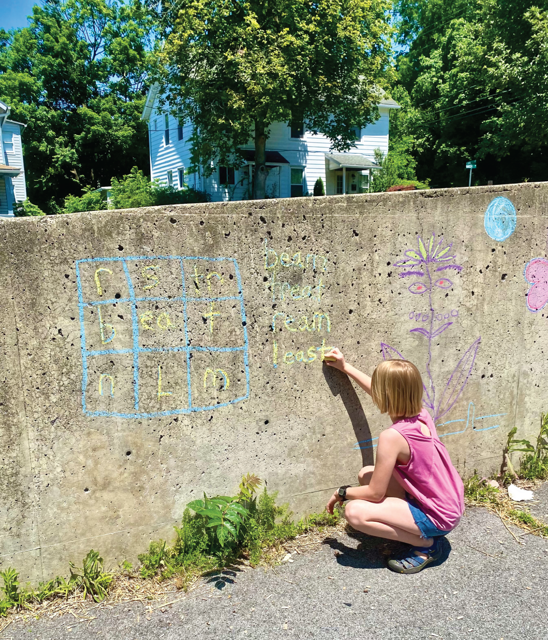 Photo depicts a student working on a word square.