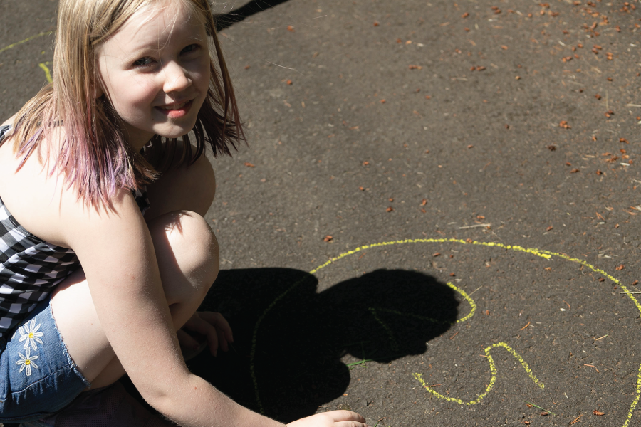 Photo depicts drawing circles for a variation of the bean bag toss game.