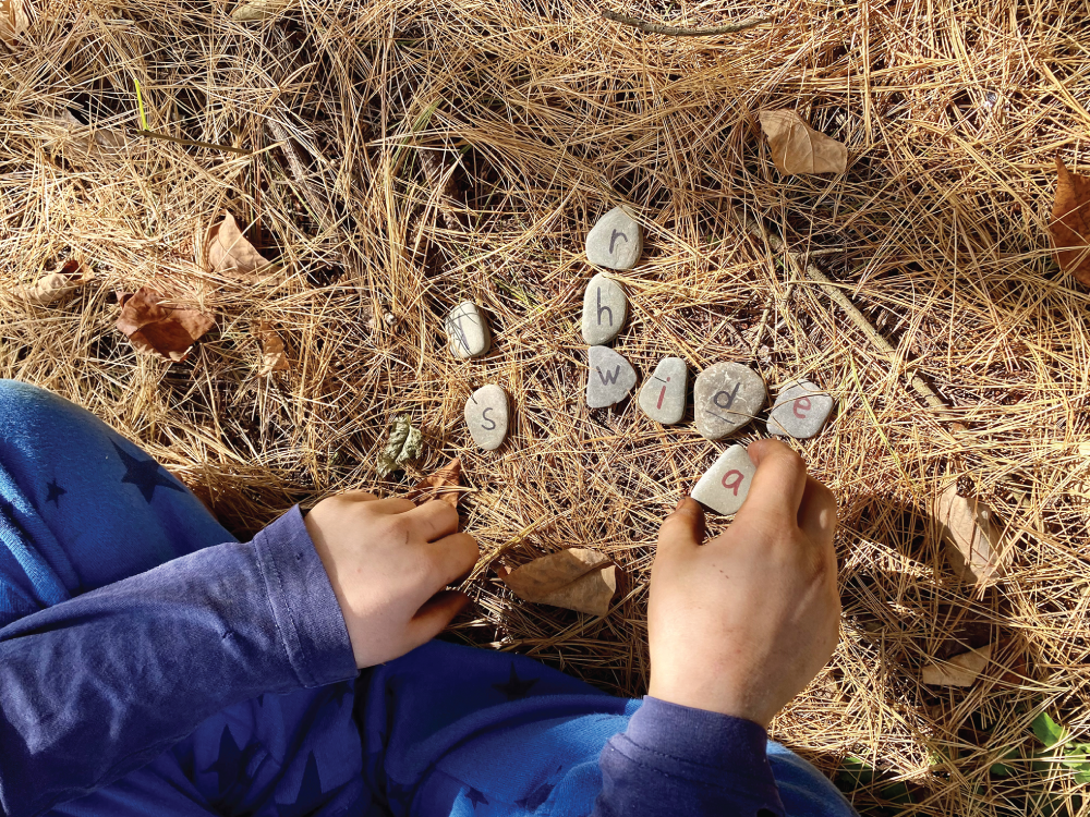 Photo depicts playing the change a letter game.