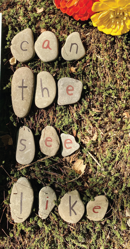 Photo depicts practicing high-frequency words with letter rocks.