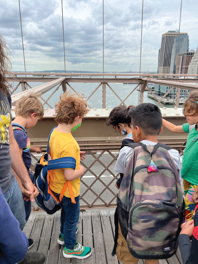 Photo depicts students looking at the many examples of arrays on
the structure of the Brooklyn Bridge