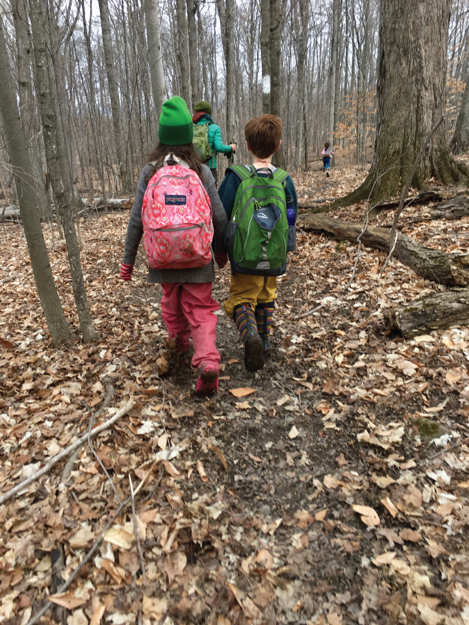 Photo depicts students heading out to their sit spots.