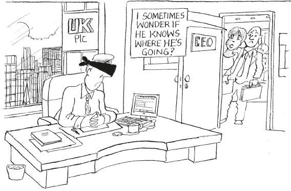 Two colleagues, a man and a woman, peeking into the CEO's office. The CEO has his eyes bound with a black band and frowning at his desk. The woman peeking in says to her colleague 'I sometimes wonder if he knows where he's going.'