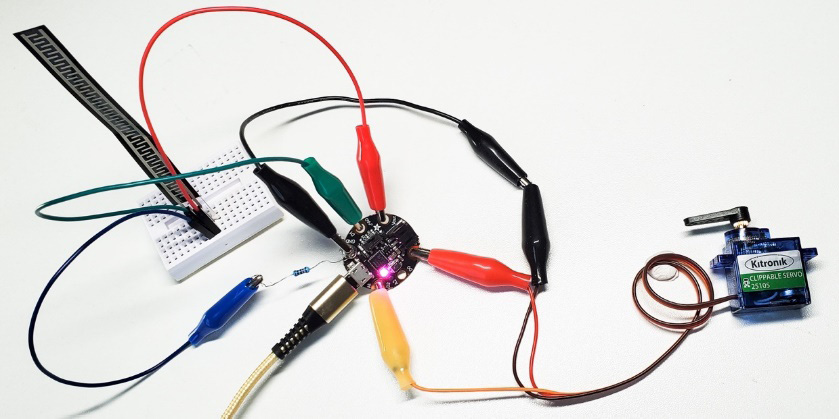 Figure 4.20 – The Gemma M0 board with crocodile clips
