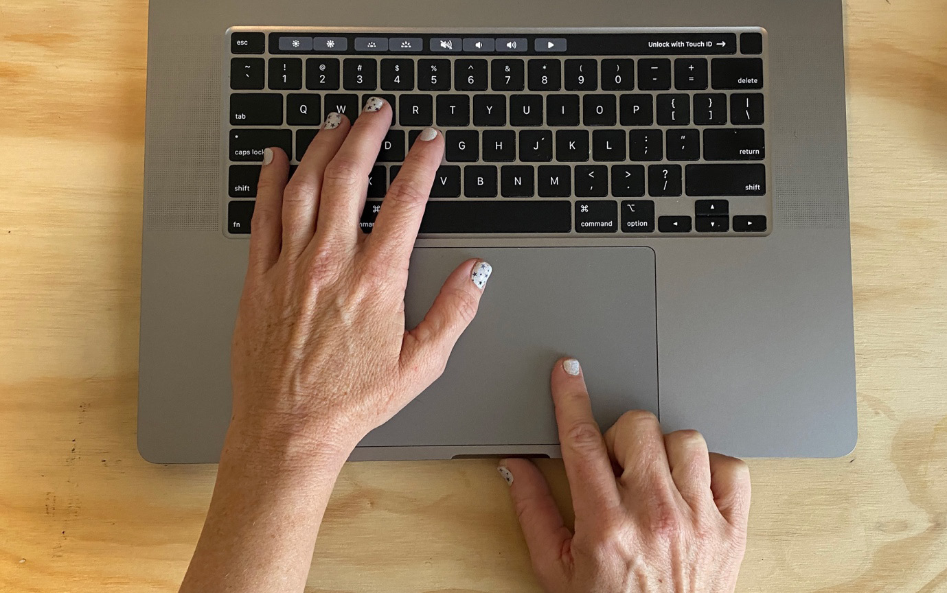 Figure 7.10 – A dominant right hand on the touchpad and a left hand on the keyboard
